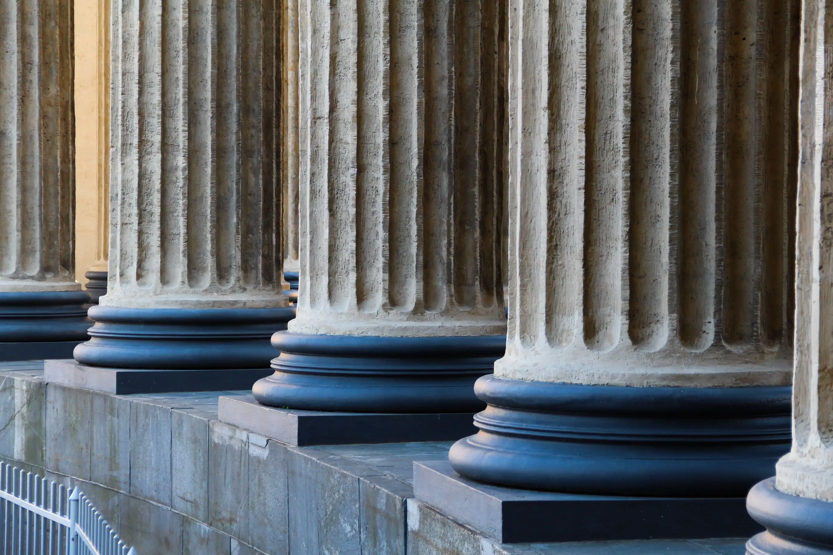 Stone columns line the front of a public building.