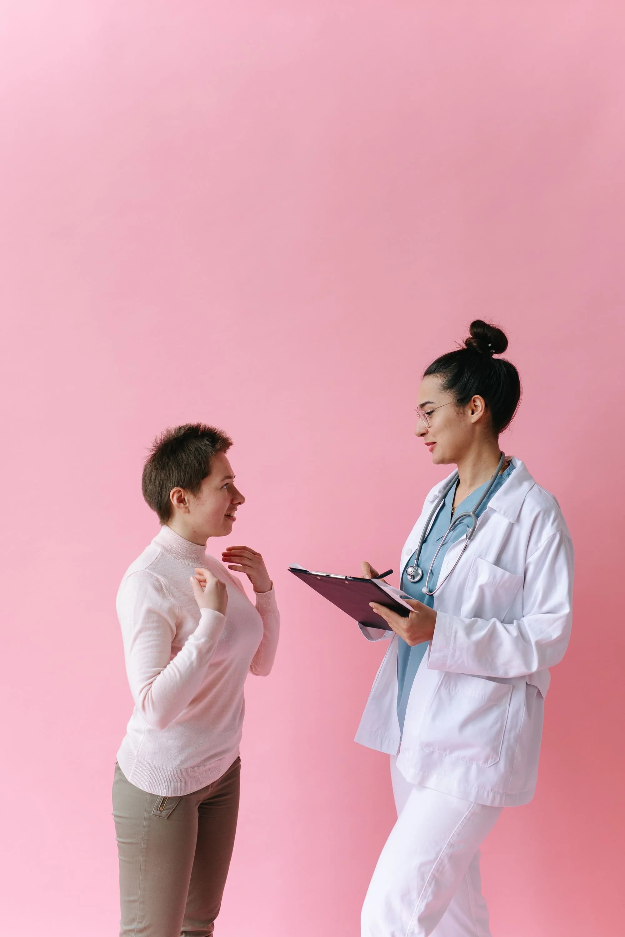 A clinician and a patient discuss care in an unbranded setting.